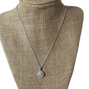 Cubic zirconia cluster pendant necklace.